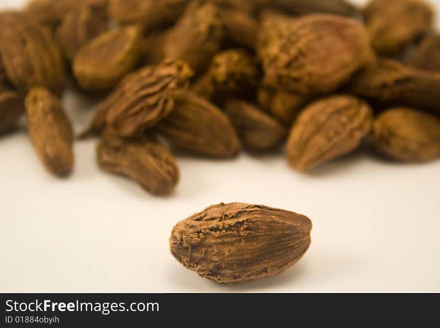 Black cardamom isolated on white