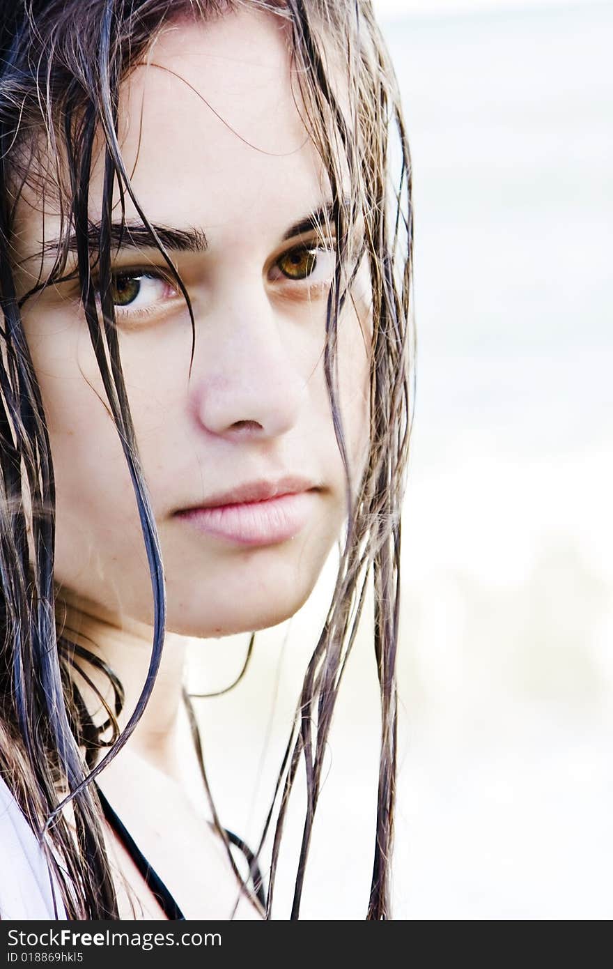 Beautiful green eyed woman portrait with wet hair.