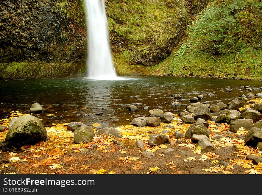 Landscape of a fall waterfall. Landscape of a fall waterfall