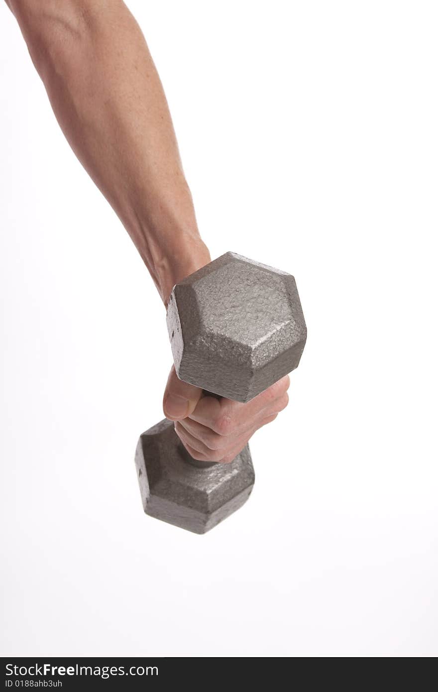 Woman's arm holding a small barbell against solated white background. Woman's arm holding a small barbell against solated white background