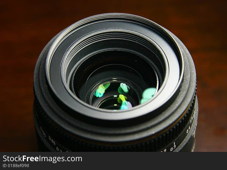 Close-up of lens with focus on reflection of fluorescent lamp. Close-up of lens with focus on reflection of fluorescent lamp