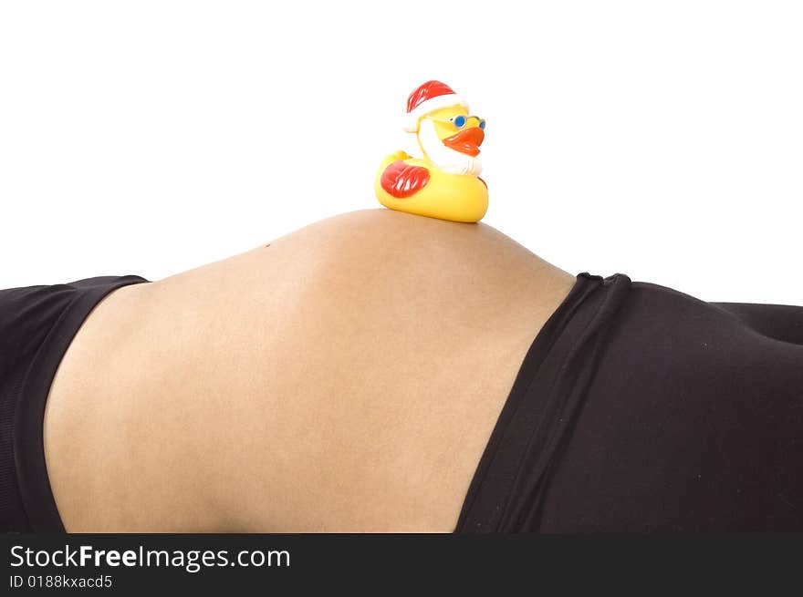 30 weeks pregnant teenager with christmas duck on her belly