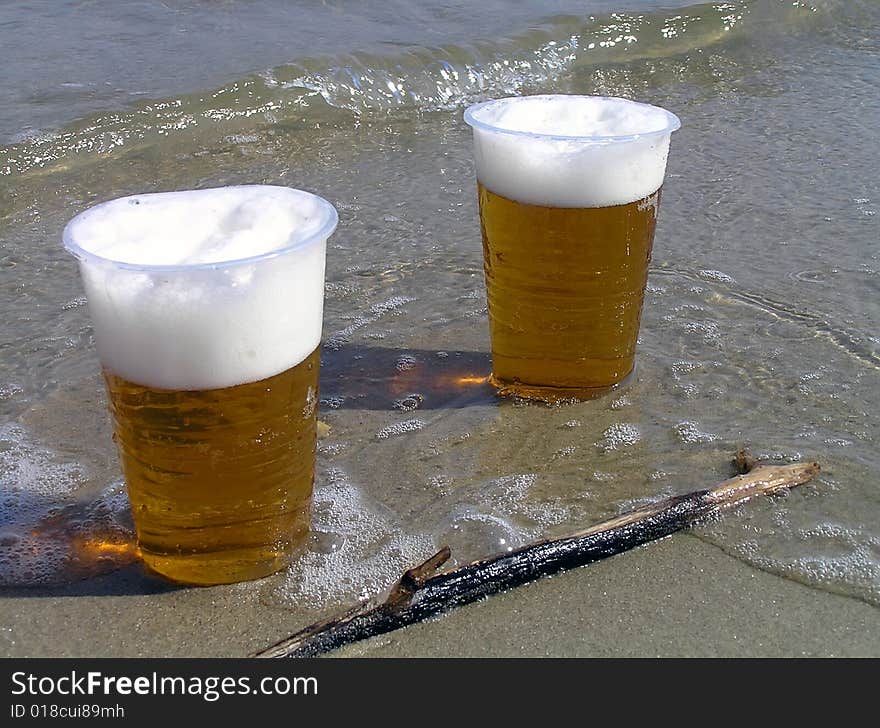 Two plastic glasses with beer