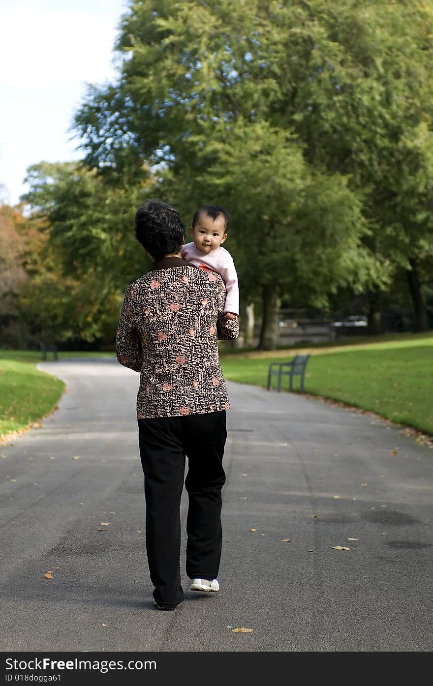 Grandmother and granddaughter in park