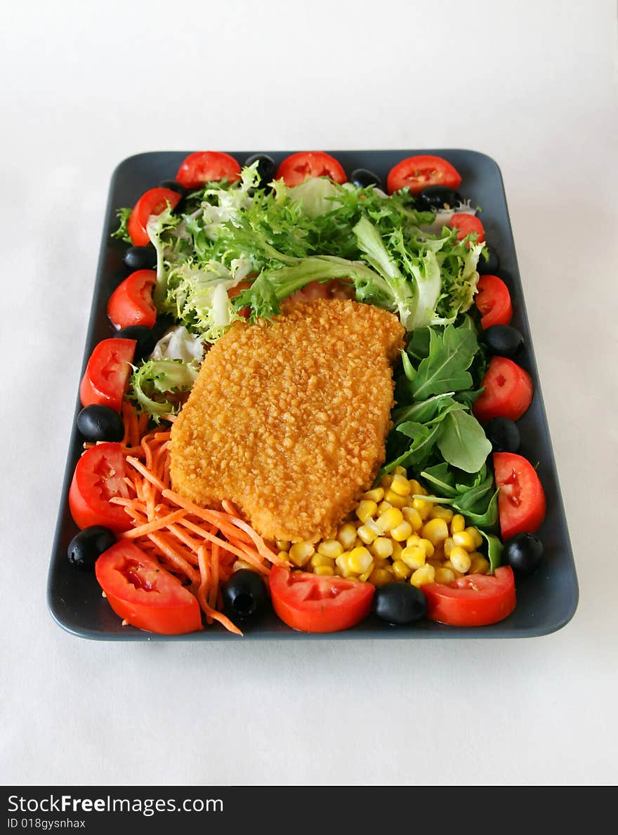 Mixed salad with chicken for a fast lunch. Mixed salad with chicken for a fast lunch