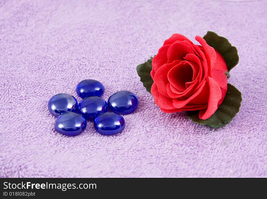 Scented rose on a background lilac towel. Scented rose on a background lilac towel