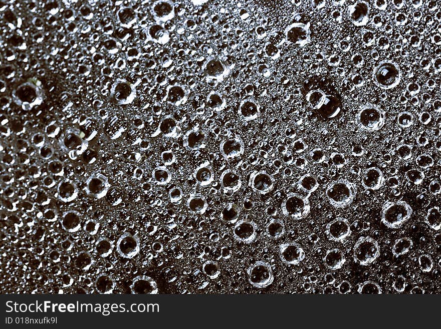 Some water drops on black background