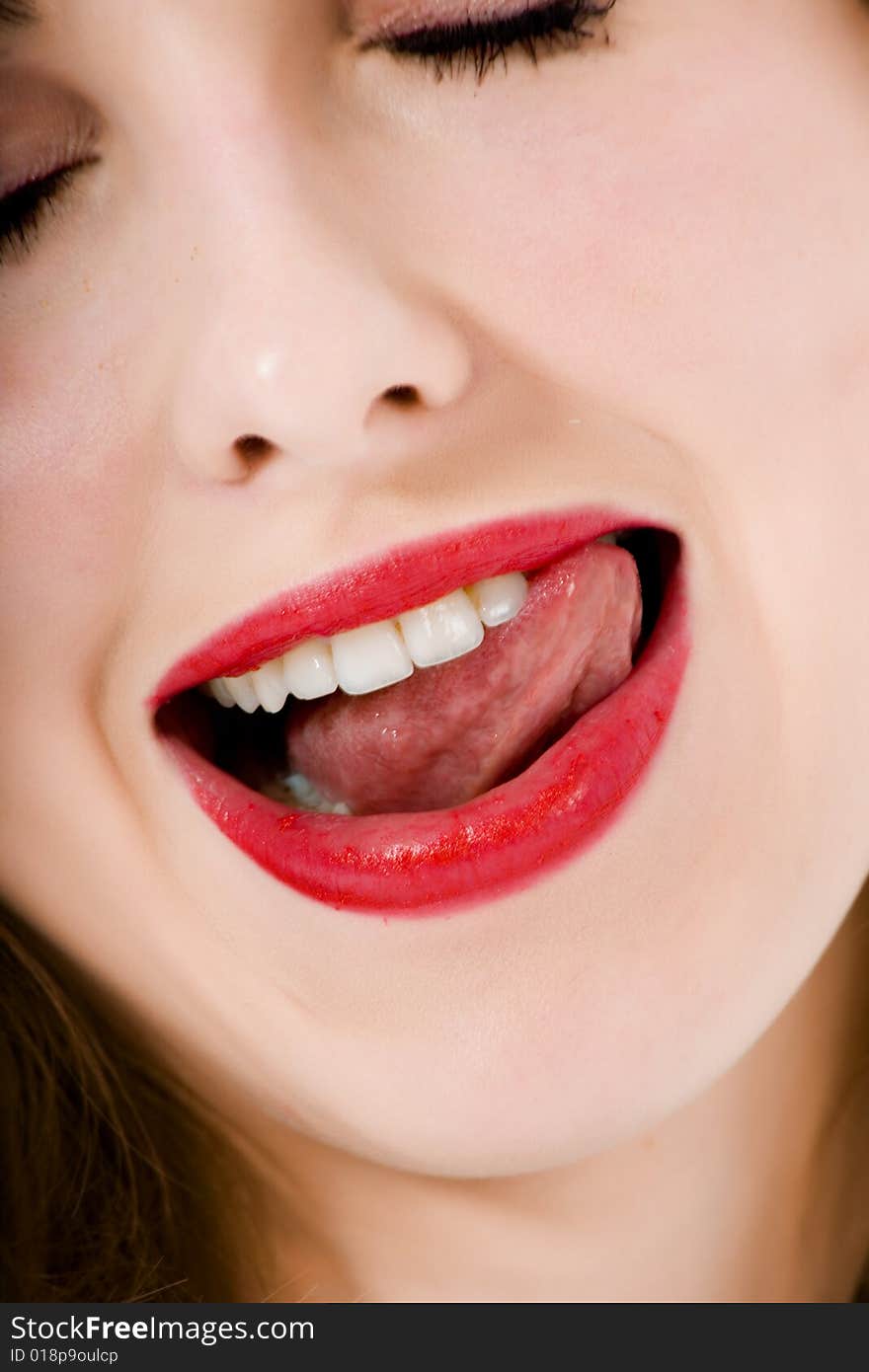 Smile of a beautiful young woman on white background