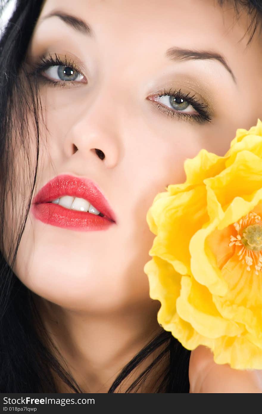 Portrait of the brunette with blue eye on white background