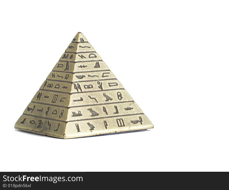 Metal Imitation Of Egyptian Pyramid Macro Isolated On White Background