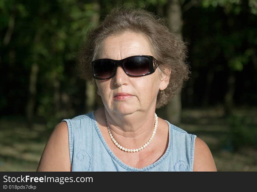 Gracious senior lady portrait in autumn. Gracious senior lady portrait in autumn