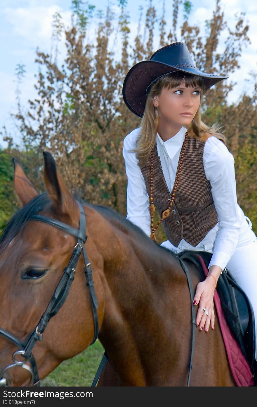 Pretty Young Woman Riding  Horse.