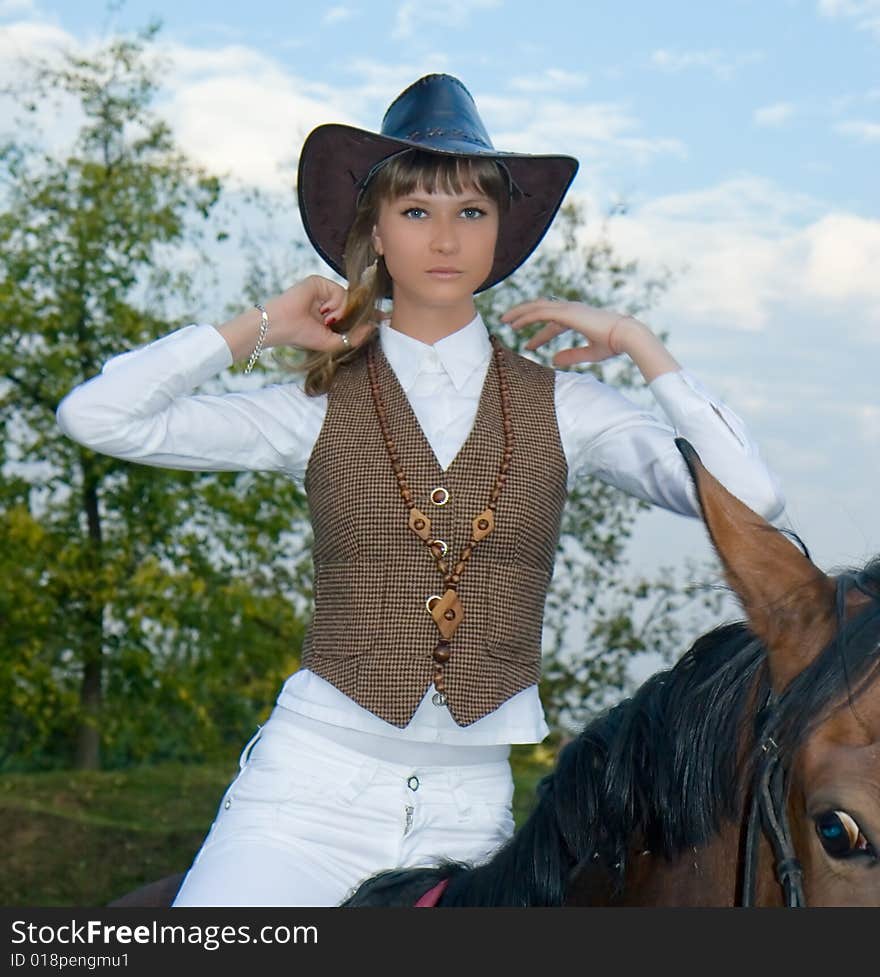 Pretty Young Woman Riding  Horse.