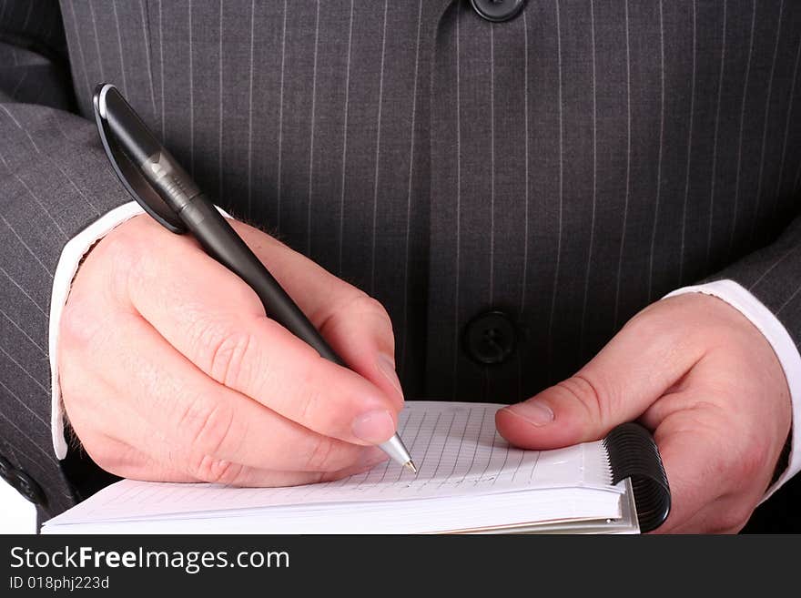 Businessman hand making notes close up. Businessman hand making notes close up