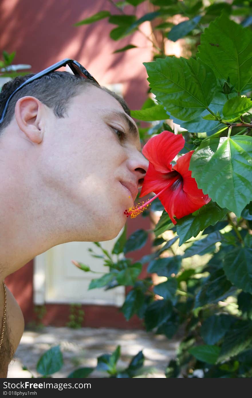 The Guy Smells A Flower