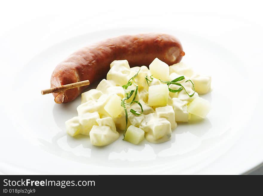 Kransky sausage with boiled potato and leek