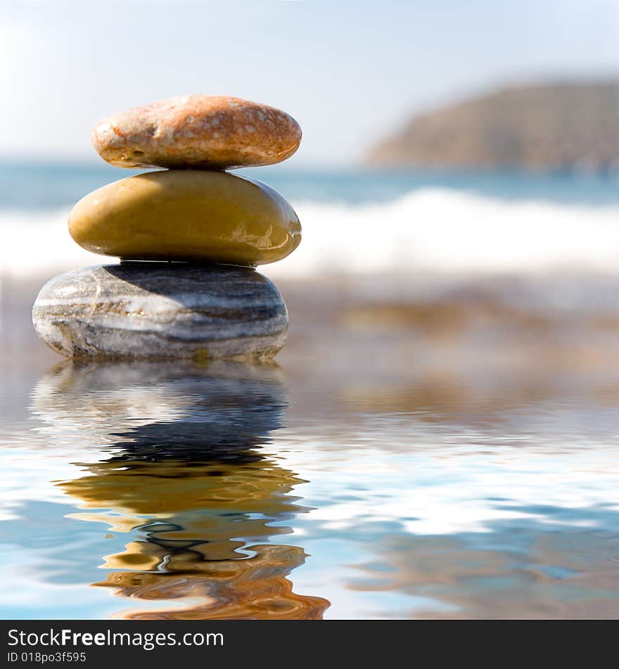 Stack of pebbles on sea background