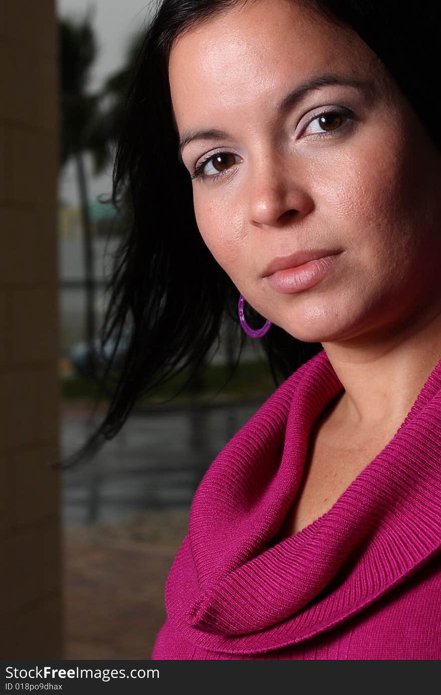 Young latina female looking at the camera