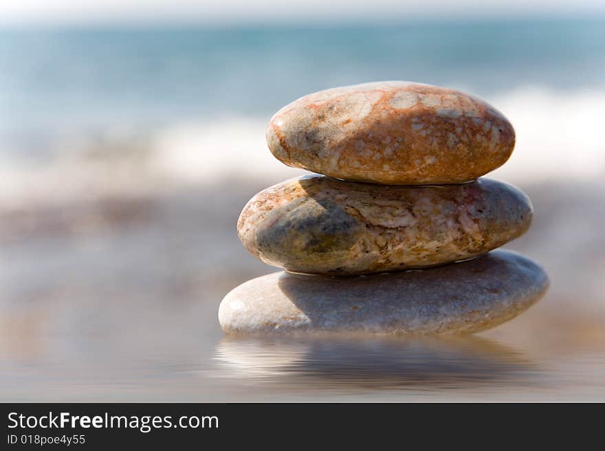 Stack of pebbles on sea background