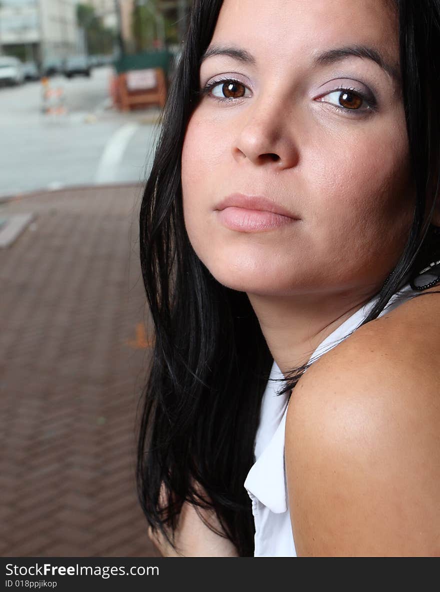 Young female staring at the camera with a blank facial expression. Young female staring at the camera with a blank facial expression