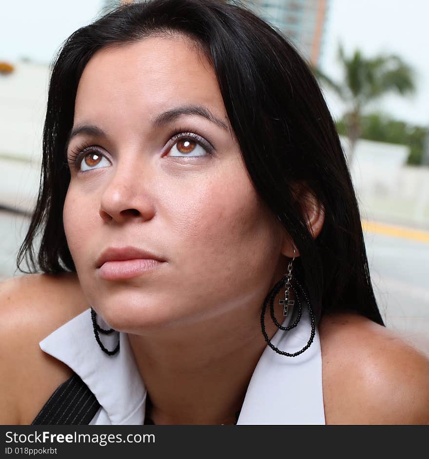 Young female looking at a light from above. Young female looking at a light from above