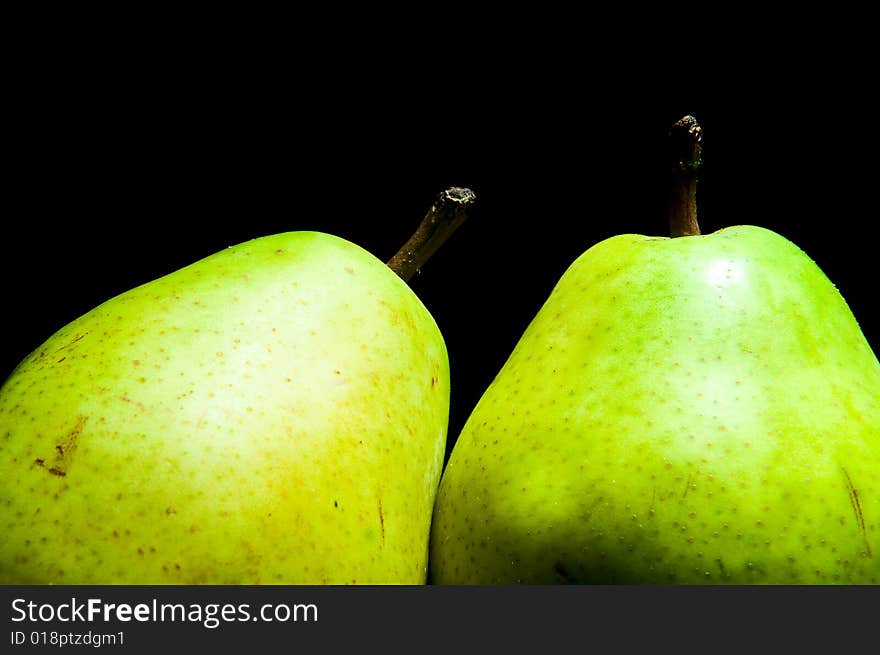 Pair of pears isolated on black background. Pair of pears isolated on black background