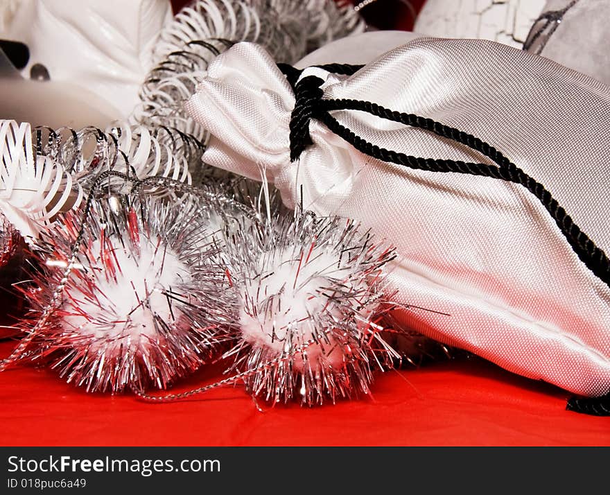 Xmas decoration with gift bag on a red cloth