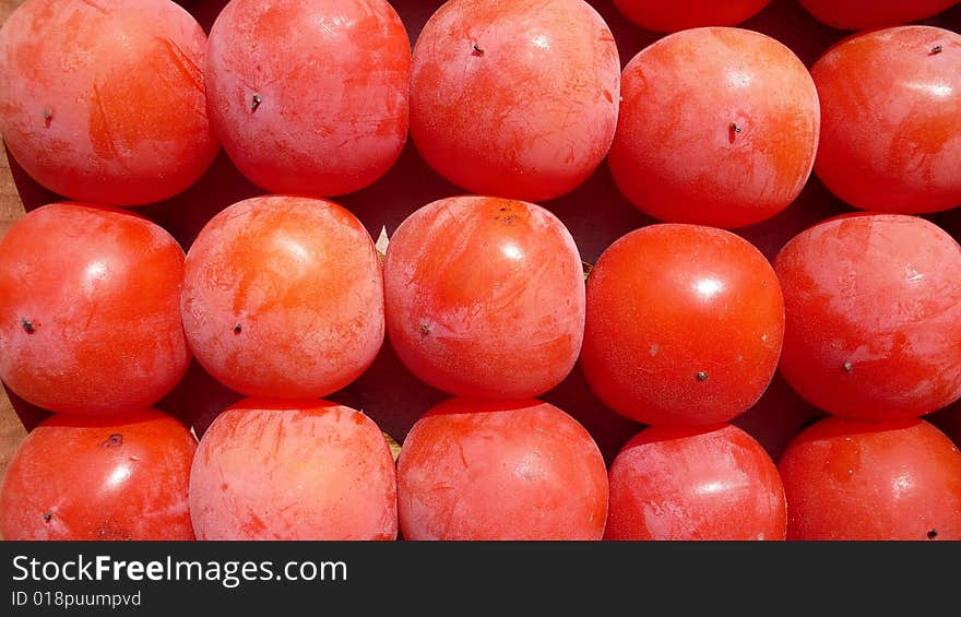 A pile of persimmons in autumn. A pile of persimmons in autumn