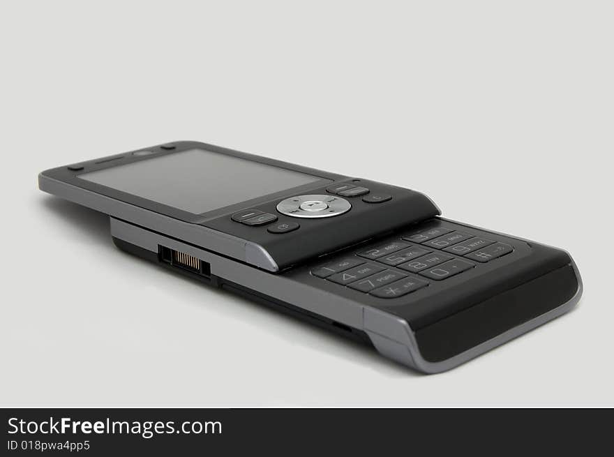 Small modern mobile phone isolated on background