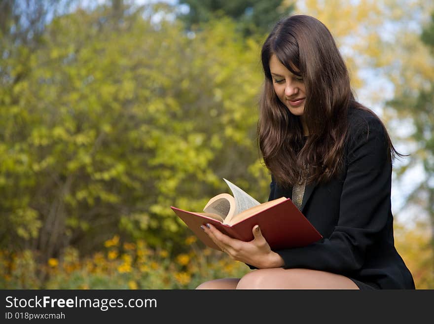 Young girl reading a book