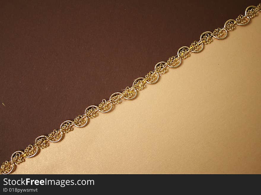 Brown-Yellow Wrapper paper texture and Gold ribbon. Brown-Yellow Wrapper paper texture and Gold ribbon