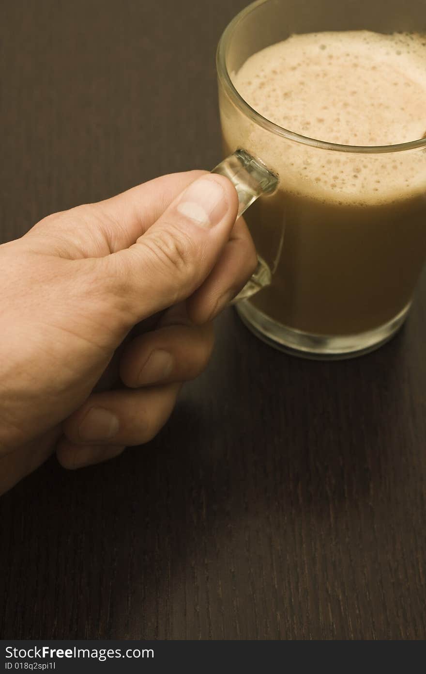 Male hand take a pot of coffee