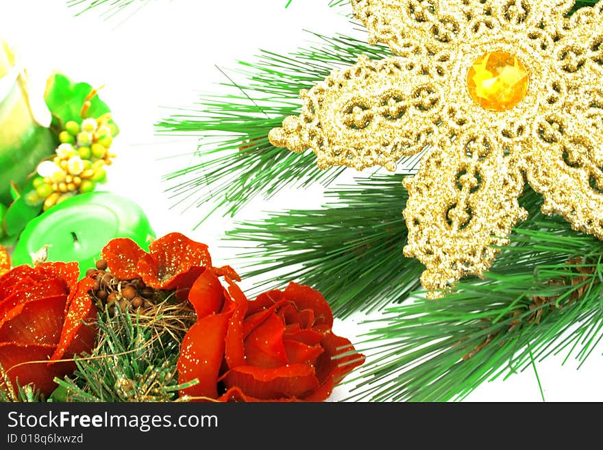 Christmas ornaments,yellow snow flake,candles,fir-tree,rose.
