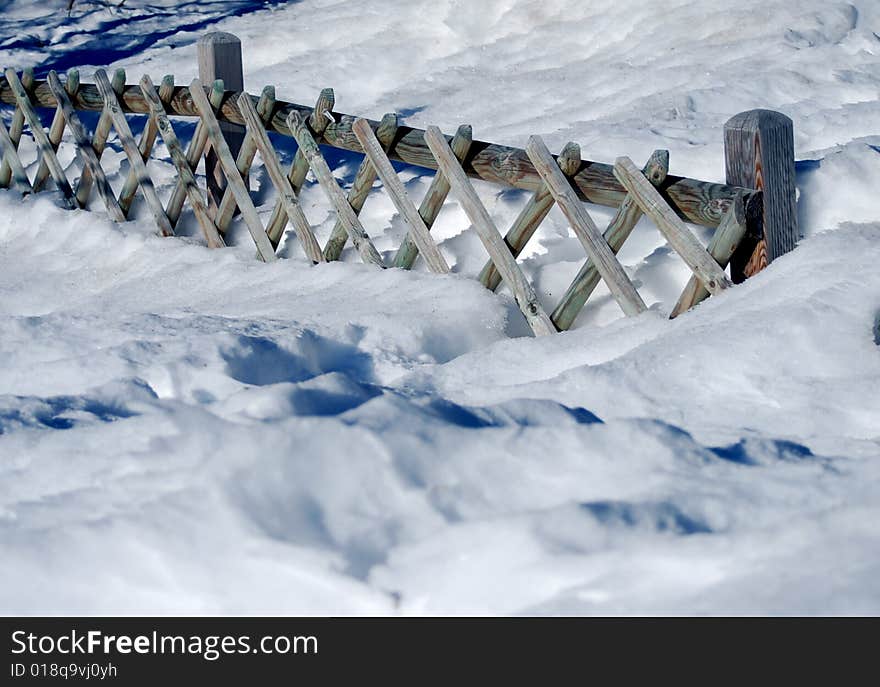 Wooden Fence On Snow