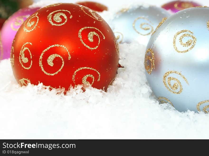 Christmas colorful balls in the snow.