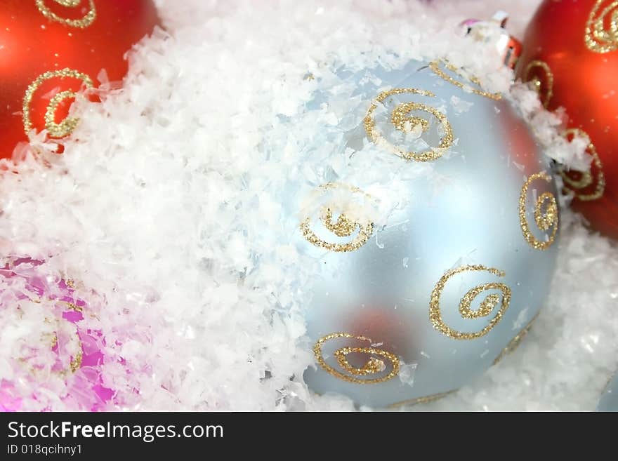 Christmas colorful balls in the snow.