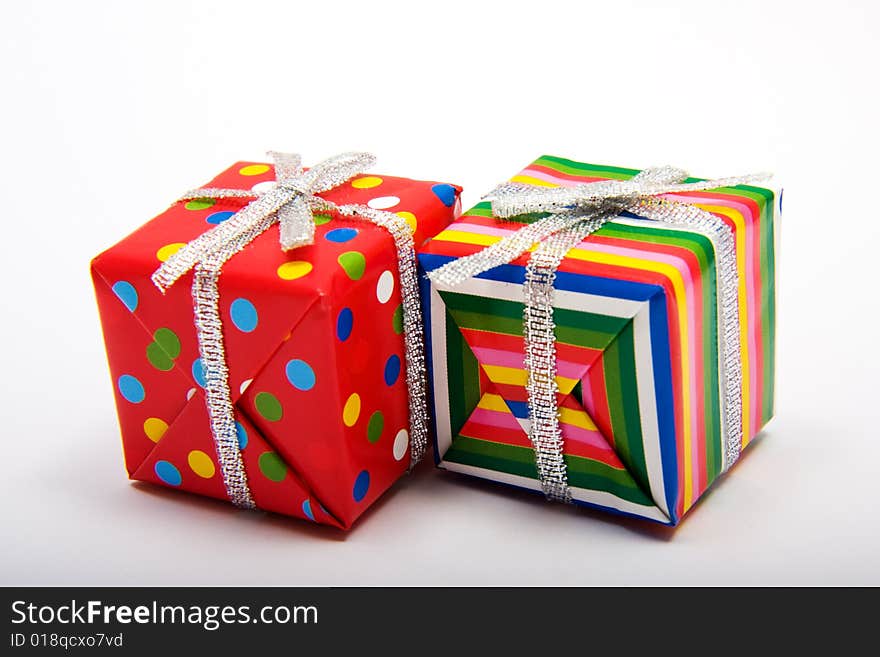 Two brightly wrapped presents for a birthday or Christmas. Two brightly wrapped presents for a birthday or Christmas