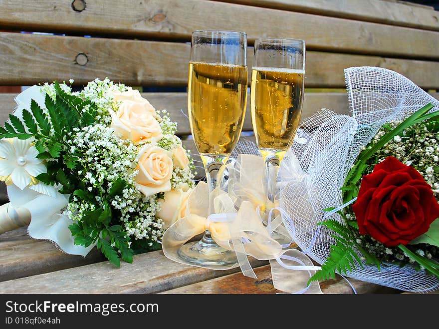 Wedding bouquets and glasses of champagne.