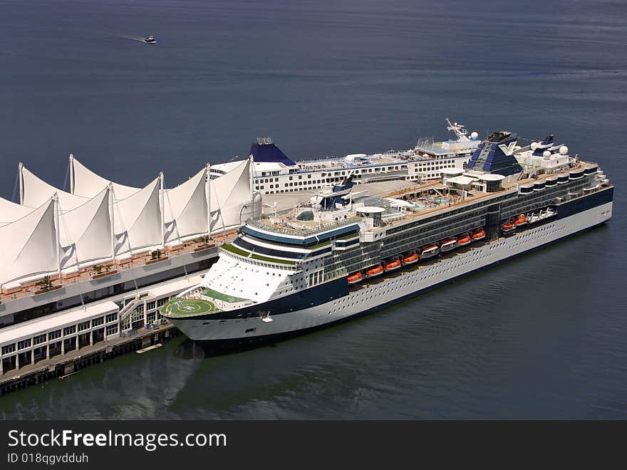 A cruise ship that has just docked into the port. A cruise ship that has just docked into the port