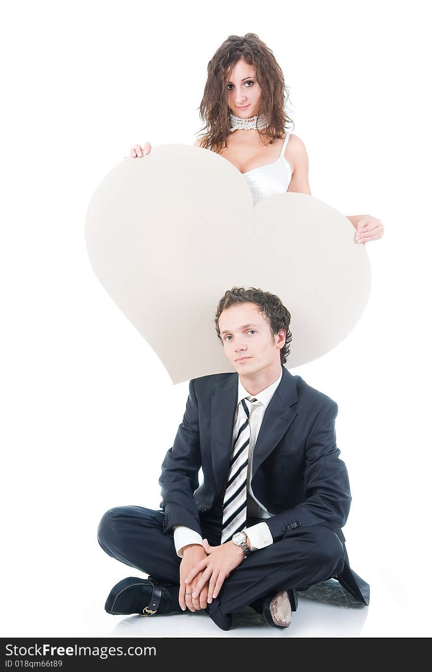 Cute couple with heart shaped copy-space, isolated on white background