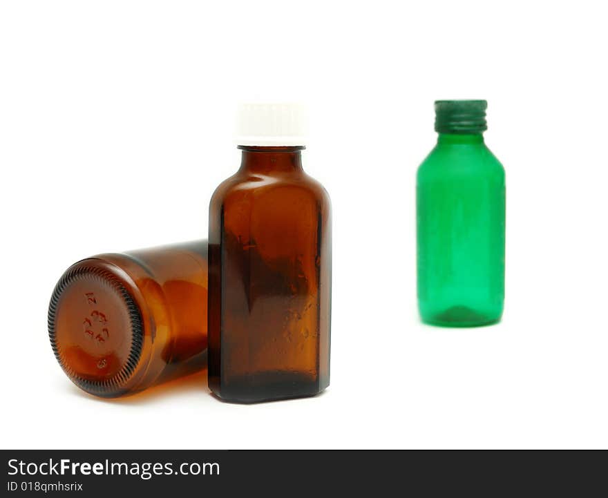 Medicine bottles of brown and green colors