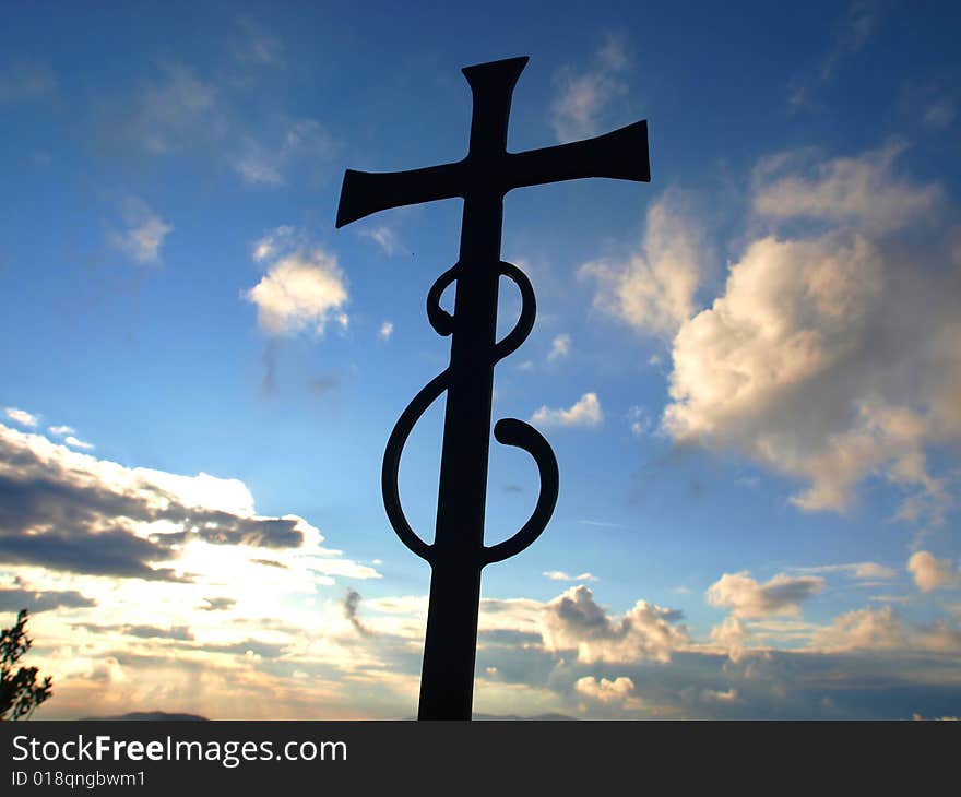 A beautiful shot of a cross in a vaporous sky