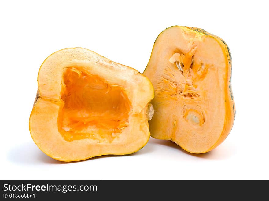 Pumpkin cut on half isolated on the white background