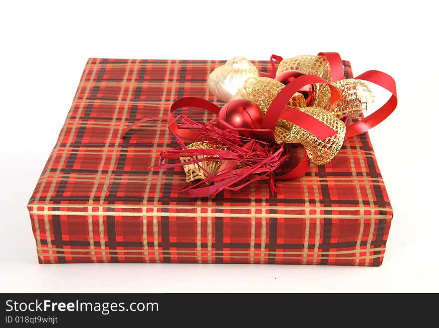 Christmas present in red paper with unusual decorations