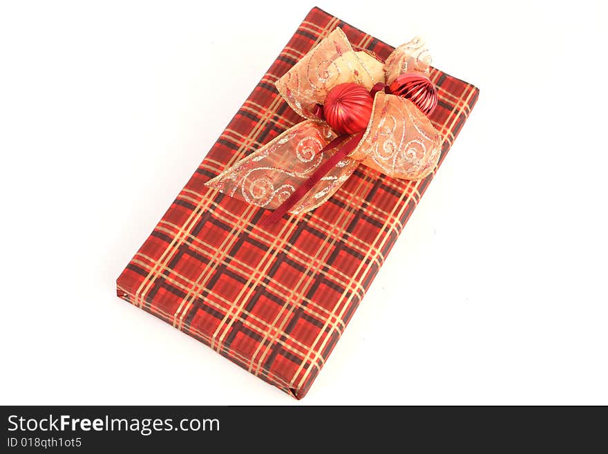 Christmas present in red paper with unusual decorations