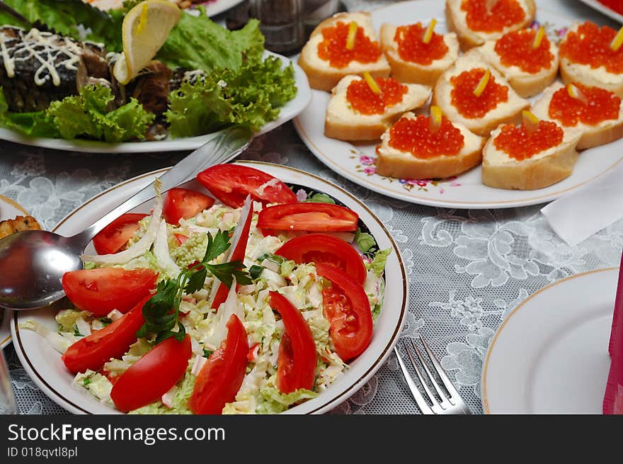 Table served with various dishes. Table served with various dishes