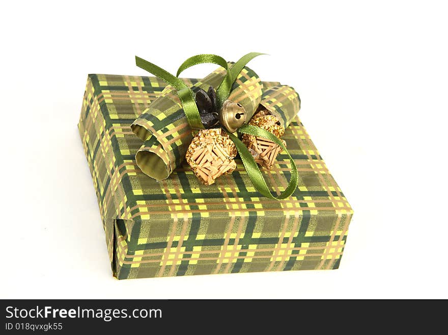 Christmas present in green paper with unusual decorations