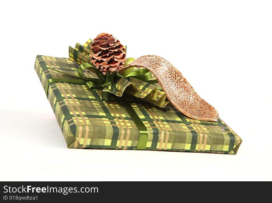 Christmas present in green paper with unusual decorations