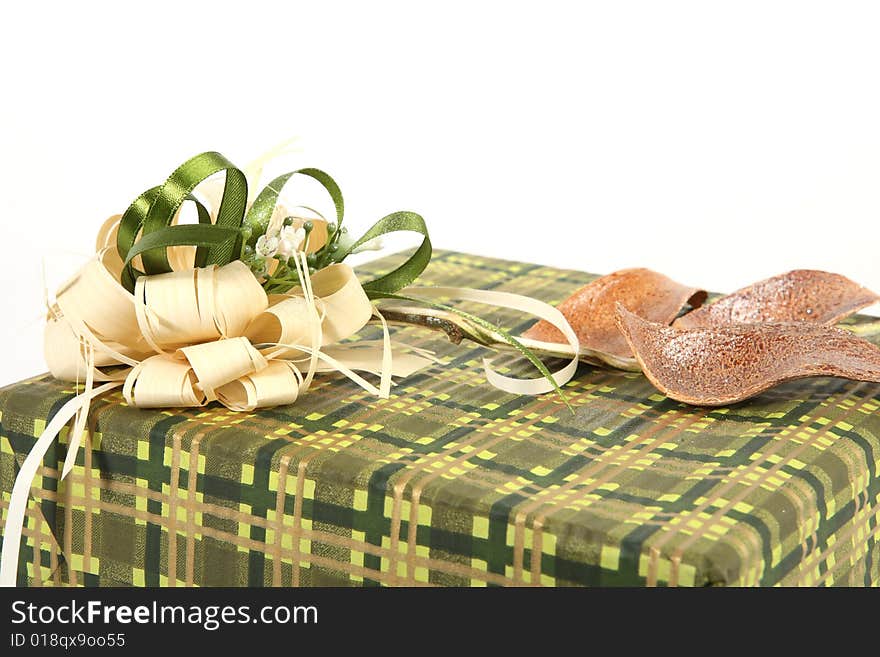 Detail of christmas present in green paper with unusual decorations