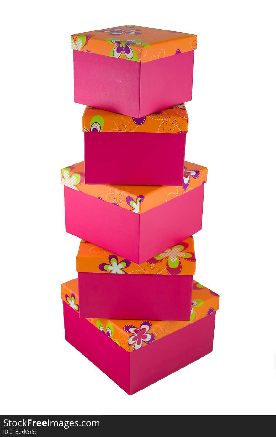 A huge stack of pink with orange flowered top presents. A huge stack of pink with orange flowered top presents.